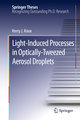 Light-Induced Processes in Optically-Tweezed Aerosol Droplets